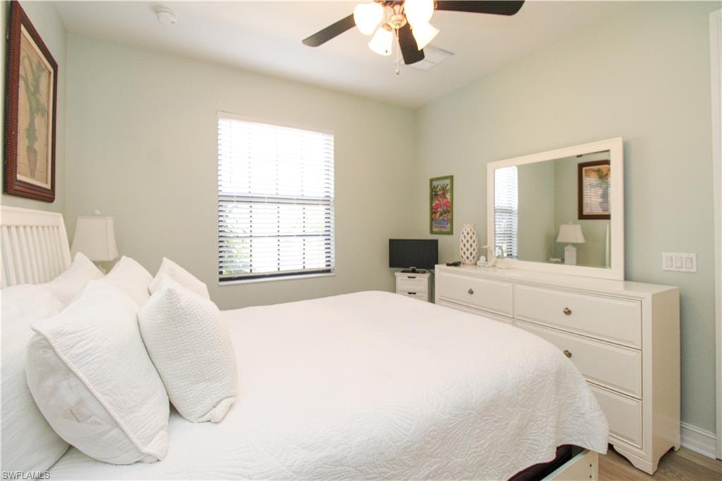 Bedroom featuring ceiling fan and light hardwood / wood-style flooring