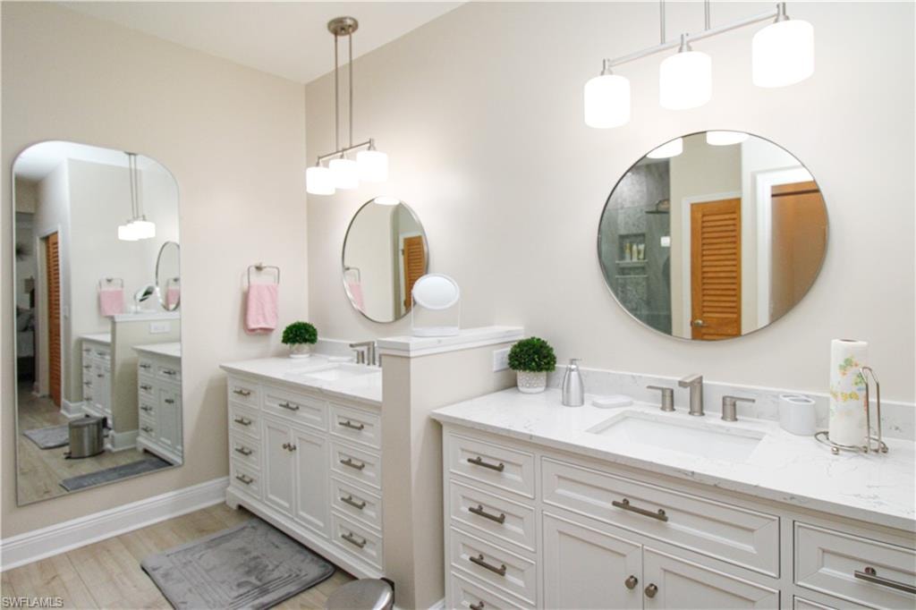 Bathroom featuring vanity and hardwood / wood-style flooring