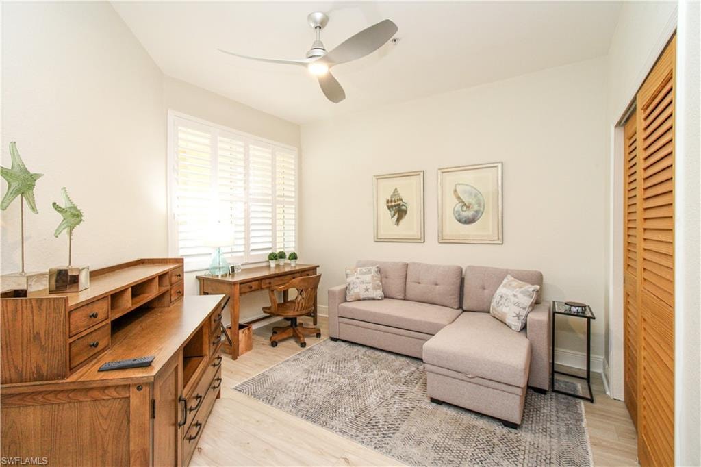Living area featuring light hardwood / wood-style floors and ceiling fan