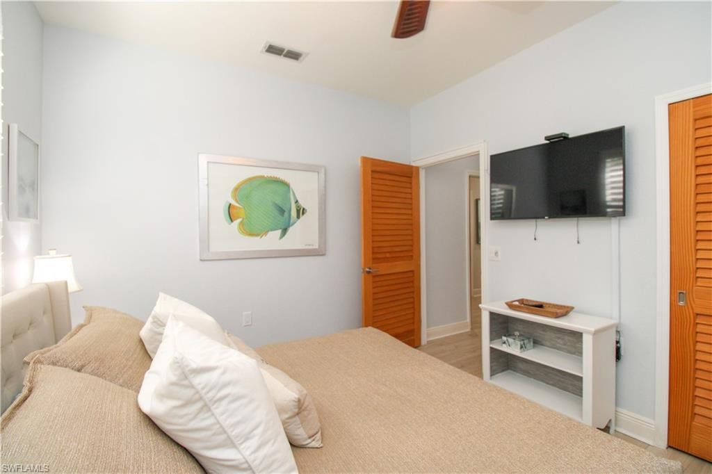 Bedroom featuring light wood-type flooring and ceiling fan