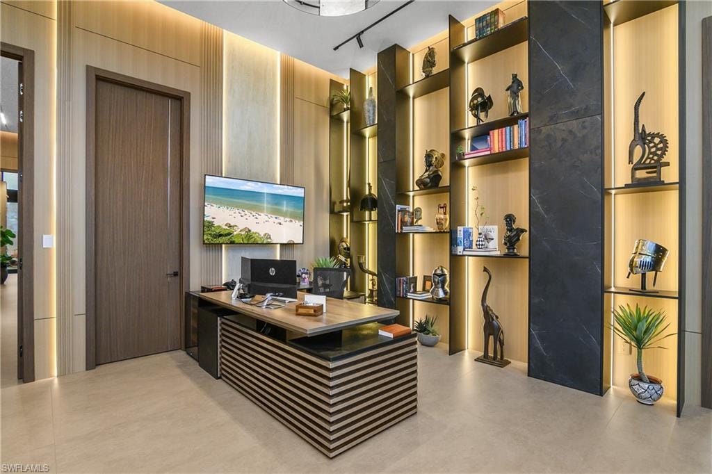 Wood-finish wall paneling, integrated strip lighting, and a built-in shelving unit with dark-toned accents