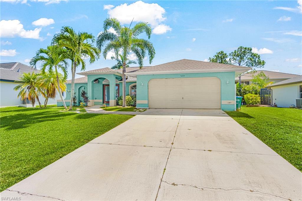Expansive residential area with numerous canals and mature palm trees