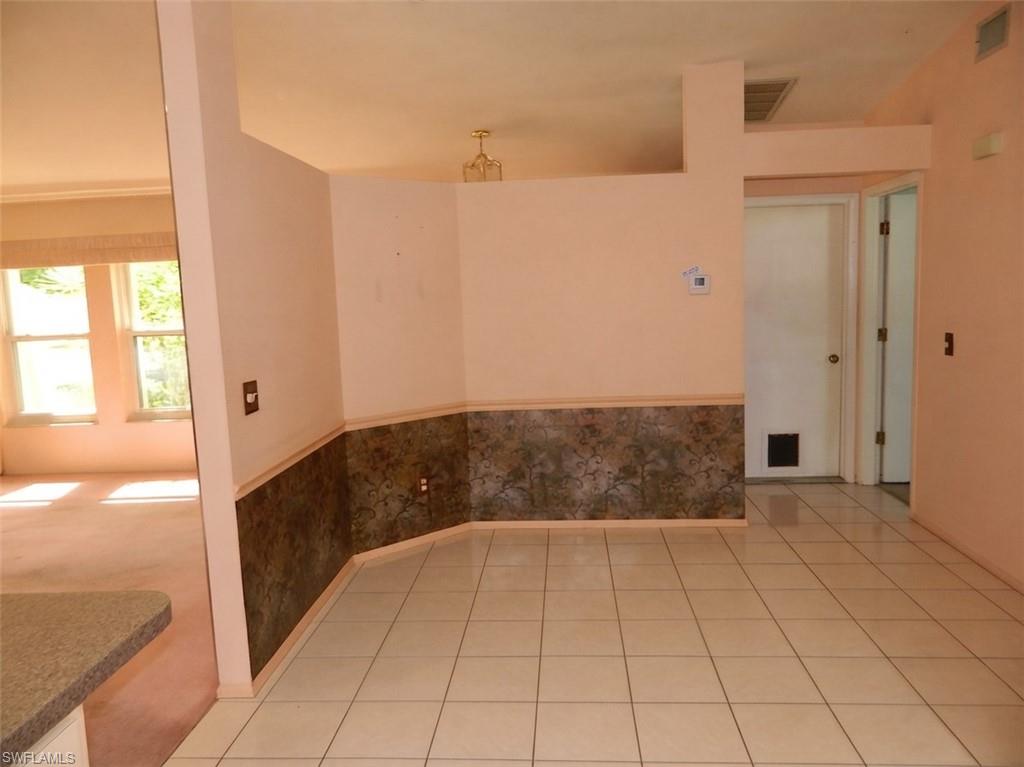 Tile flooring with a decorative wall treatment