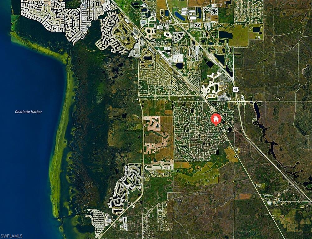 Aerial Map. Depicting the property's location within its geographic region, including Charlotte Harbor and various infrastructure elements