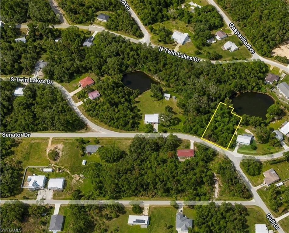 Aerial Map. Outlining the property in yellow with surrounding roads and bodies of water