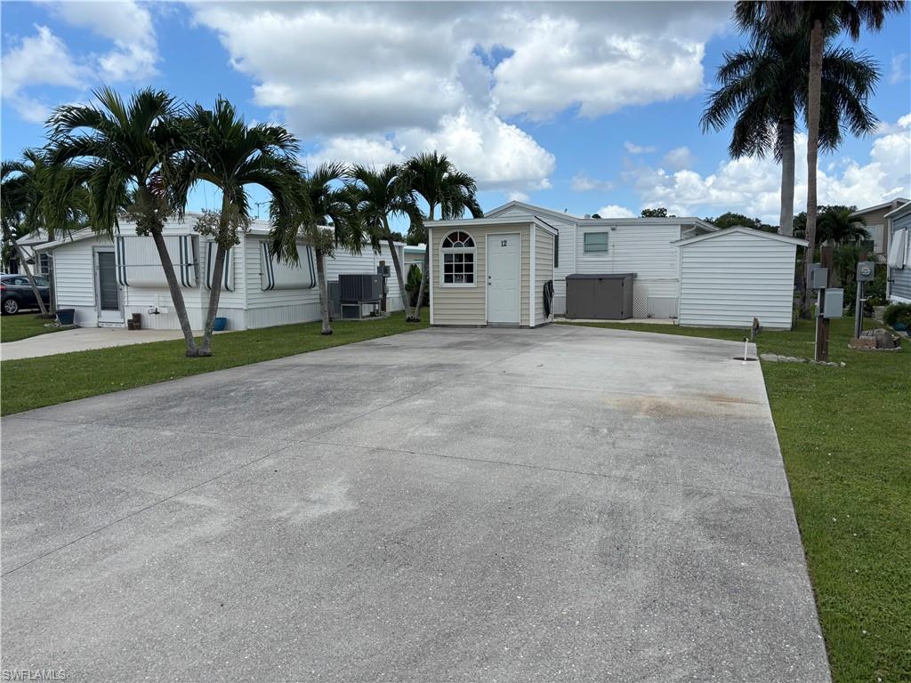 Paved driveway with adjacent manicured lawn