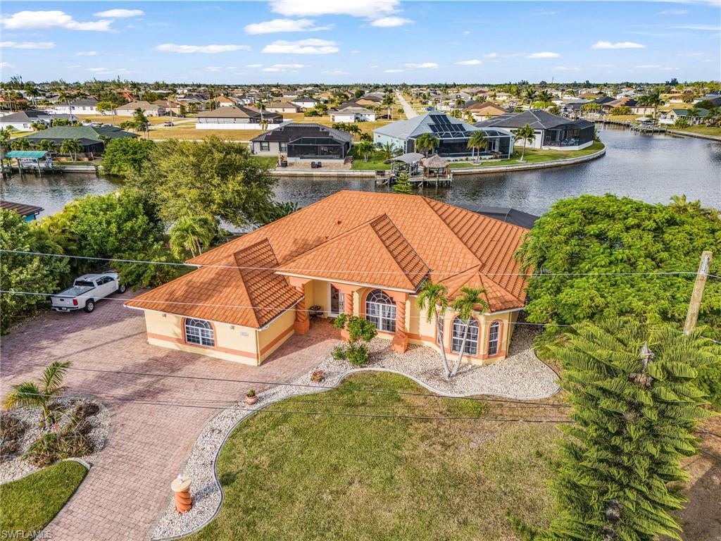 Aerial perspective of suburban area with a large body of water