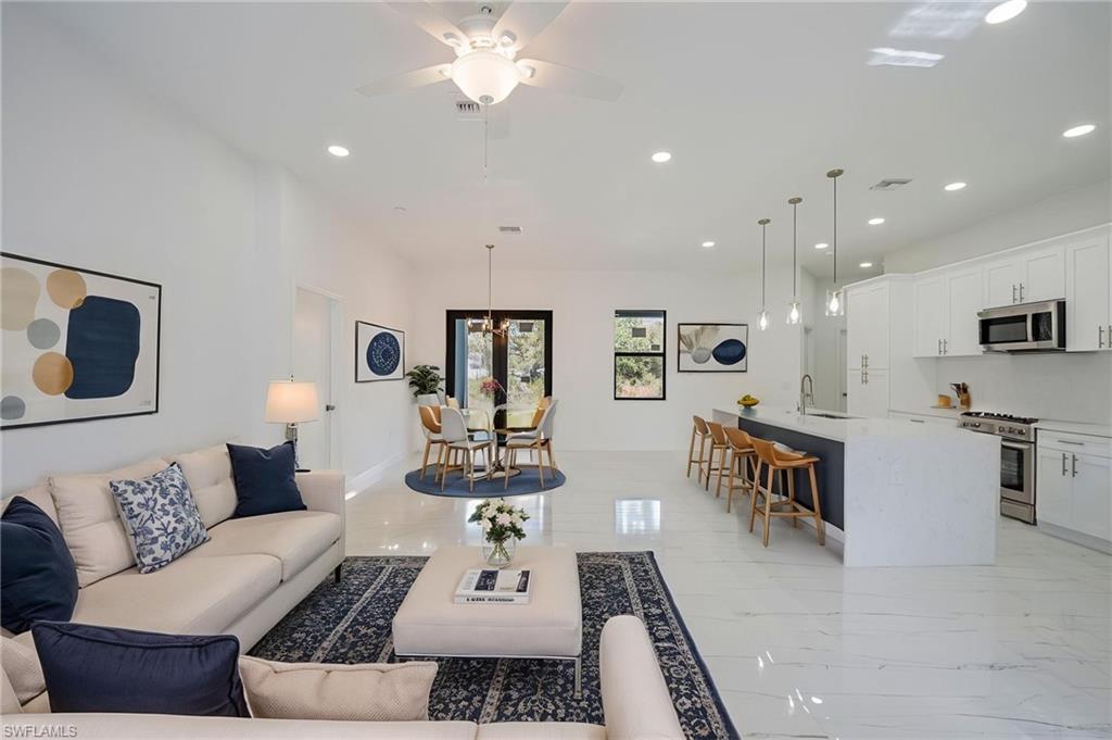 Living area featuring recessed lighting and ceiling fan