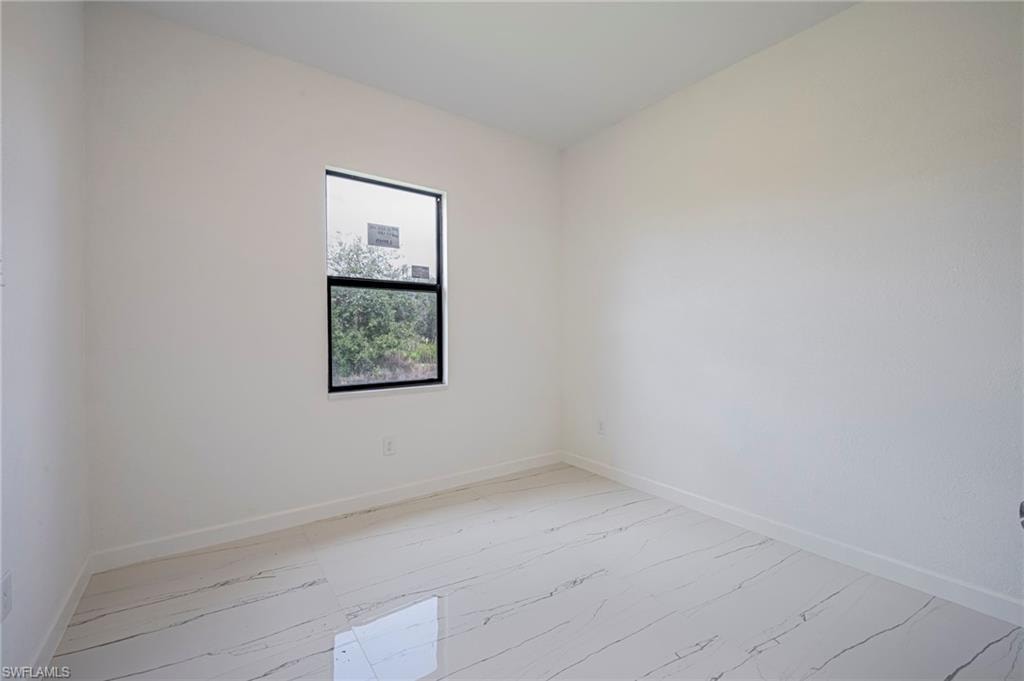 Spare room with baseboards