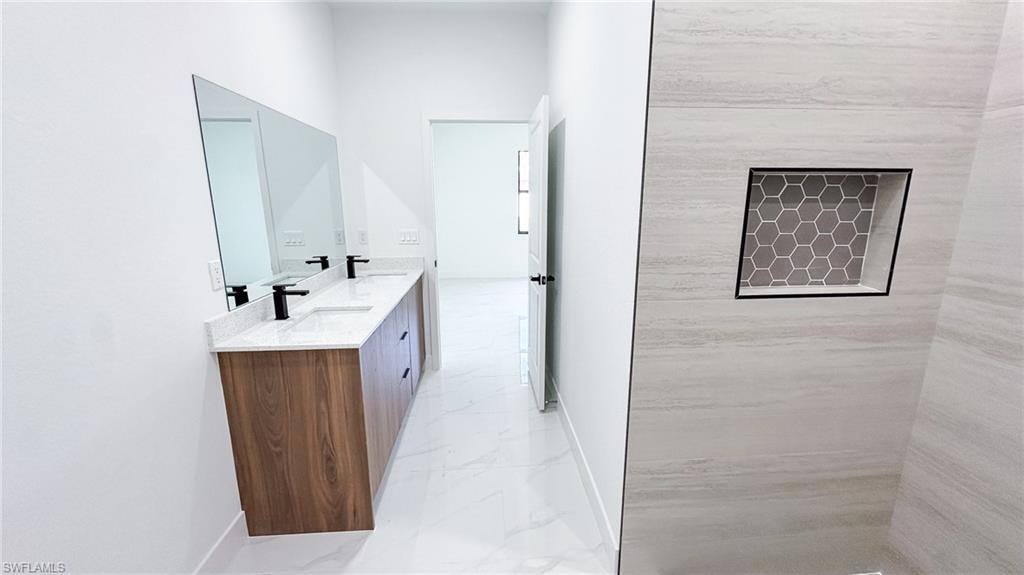 Dual vanity with wood-finish cabinetry, quartz countertops, and matte black fixtures