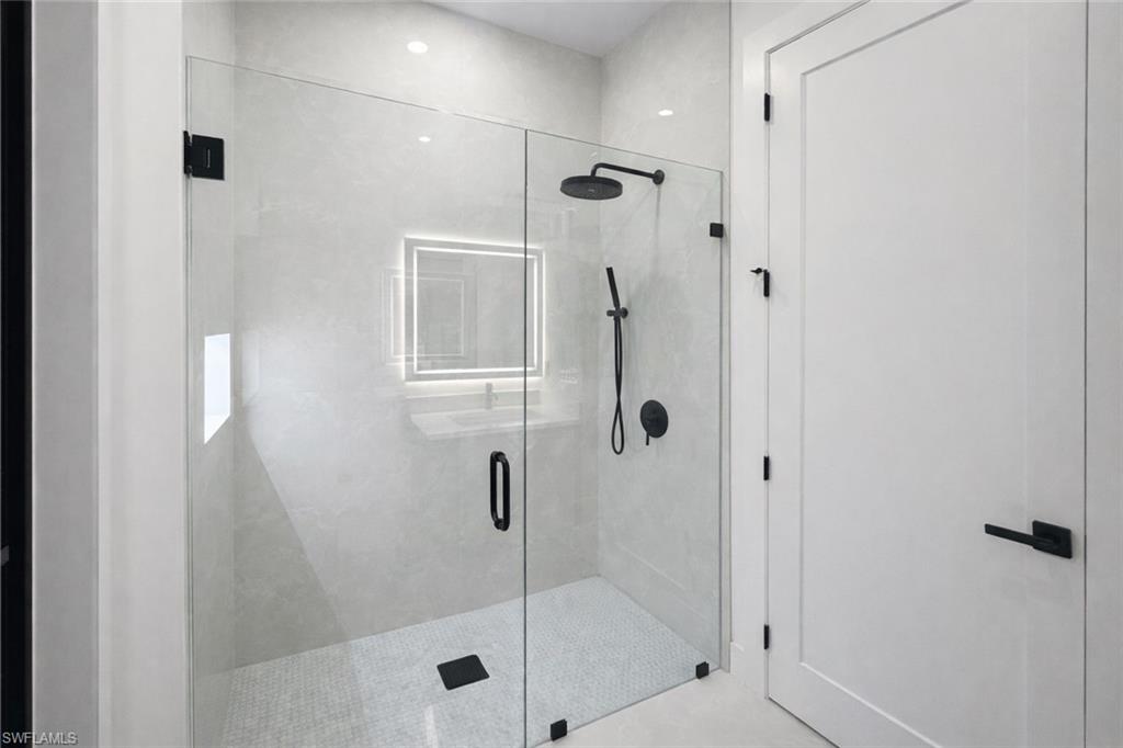 Bathroom featuring a shower stall