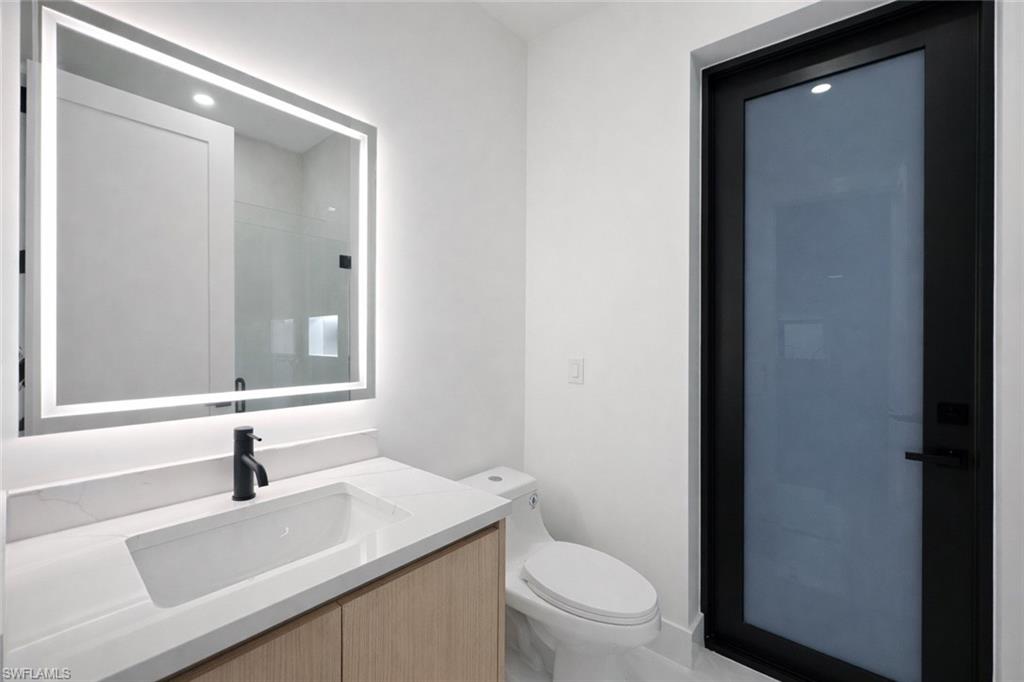 Bathroom featuring vanity and toilet