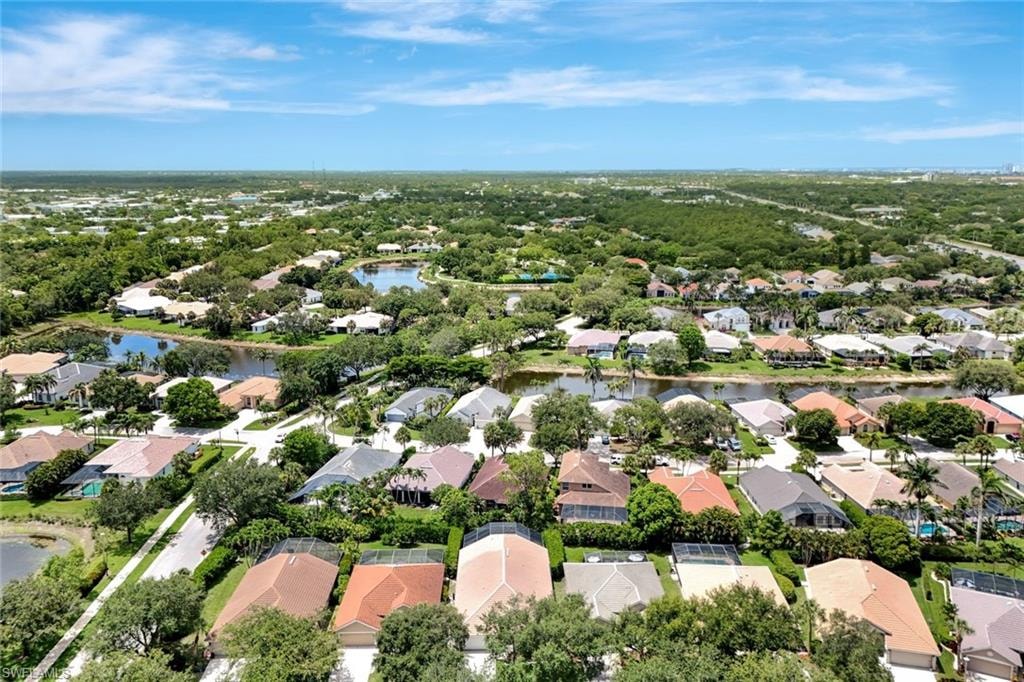 Residential community featuring a variety of architectural styles, mature landscaping, and multiple water features