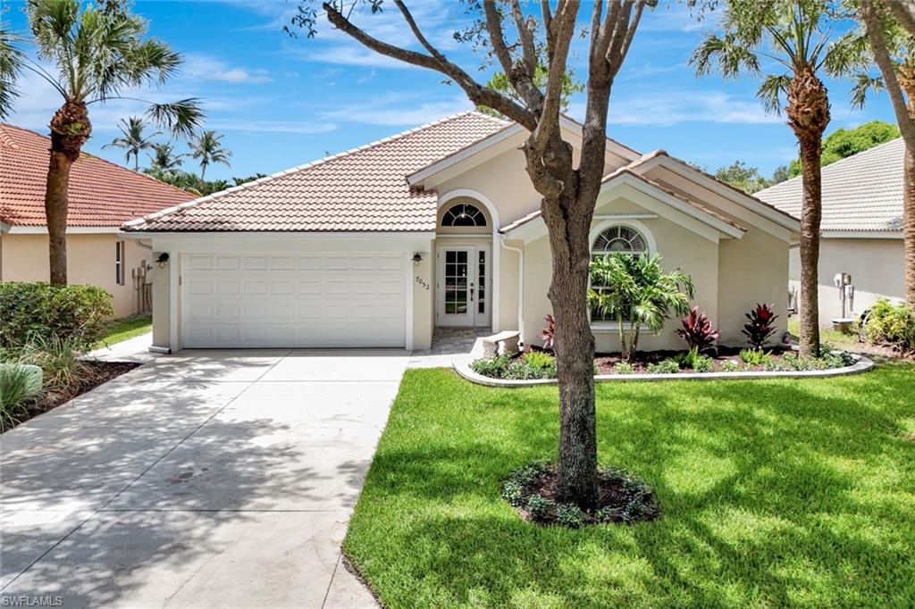 Exterior stucco finish with a tile roof