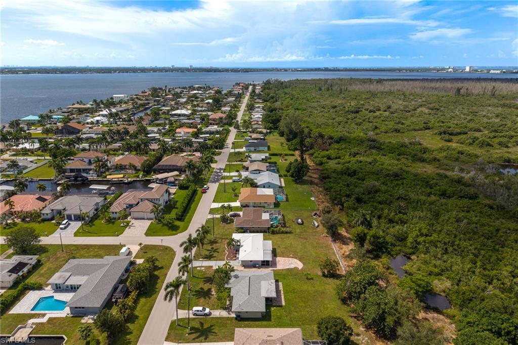 Waterfront community with extensive canal access and mature palm trees