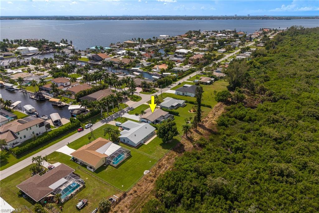 Waterfront community with canal access, mature landscaping, and an expansive natural preserve