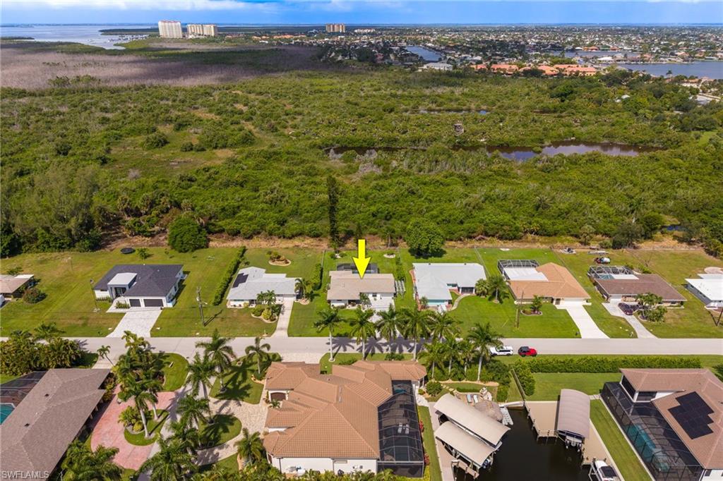 Waterfront community setting with residential properties and boat access