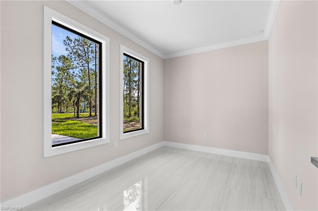 Crisp white walls with crown molding and white trim