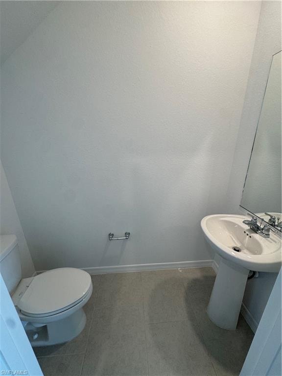 White pedestal sink with chrome faucet
