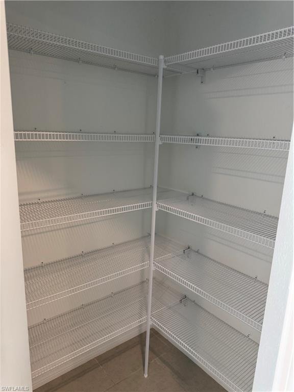 White wire shelving system with multiple tiers, providing ample storage capacity