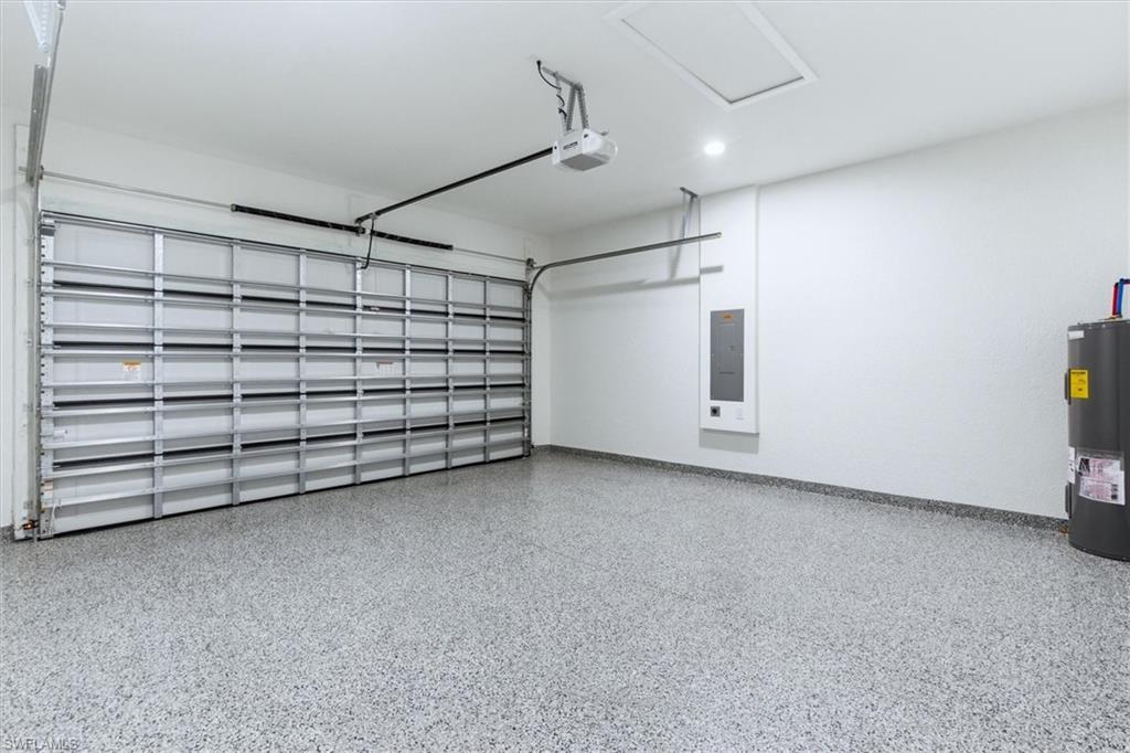 Epoxy-coated flooring, white walls, and a recessed ceiling light
