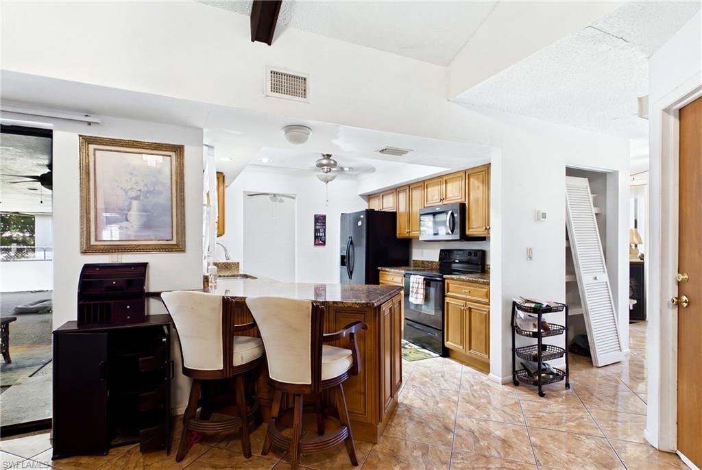 Functional kitchen with ample workspace and convenient access to the home's main living areas.