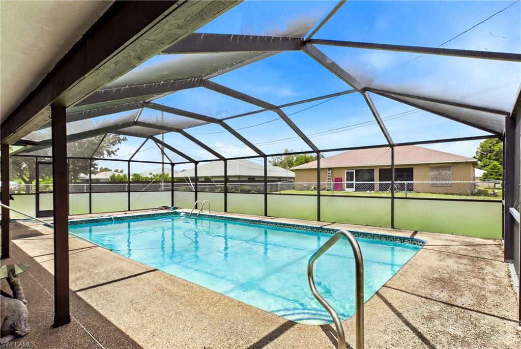 Your own private Florida oasis! Sparkling pool surrounded by a screened enclosure for year-round enjoyment.