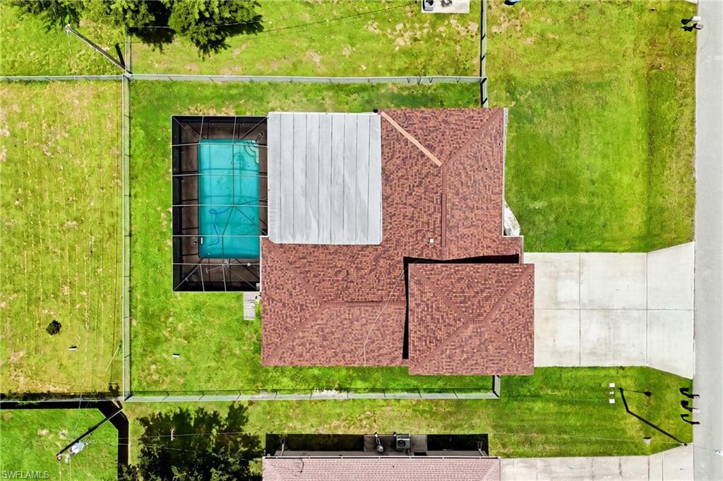 Aerial view showcasing the home's approximately 10,019 sq. ft. lot and convenient Cape Coral location.
