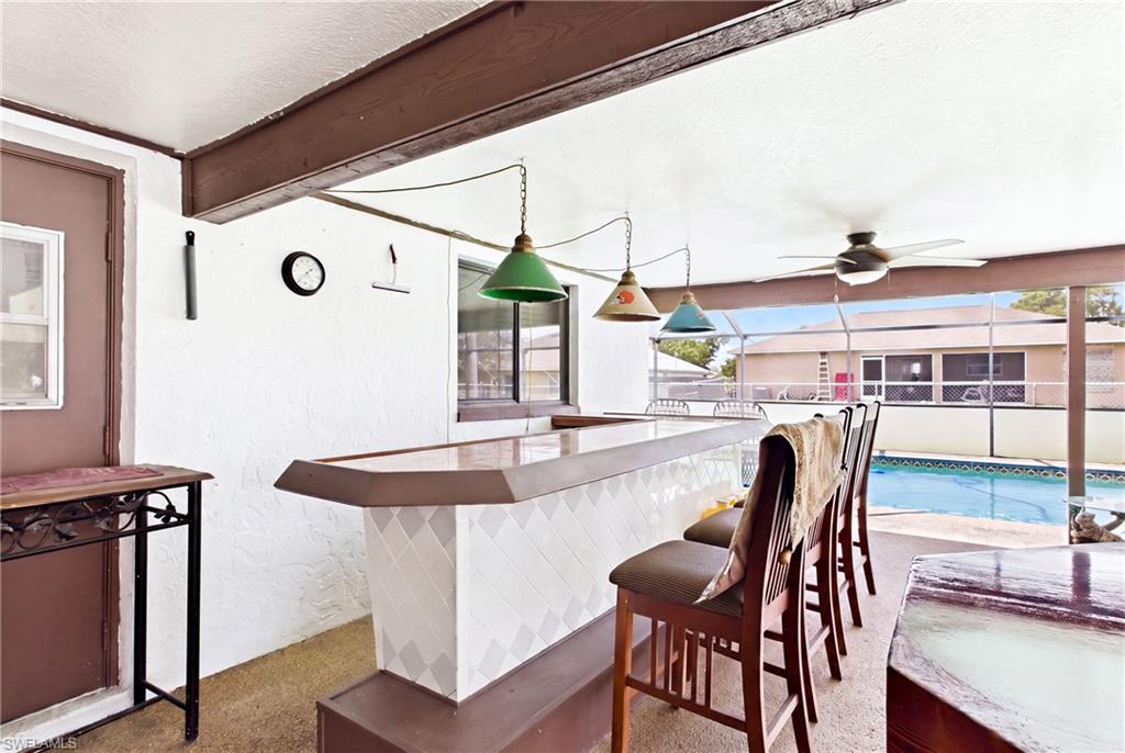 Your own poolside entertaining spot—an outdoor bar ready for cocktails, conversation, and good times!