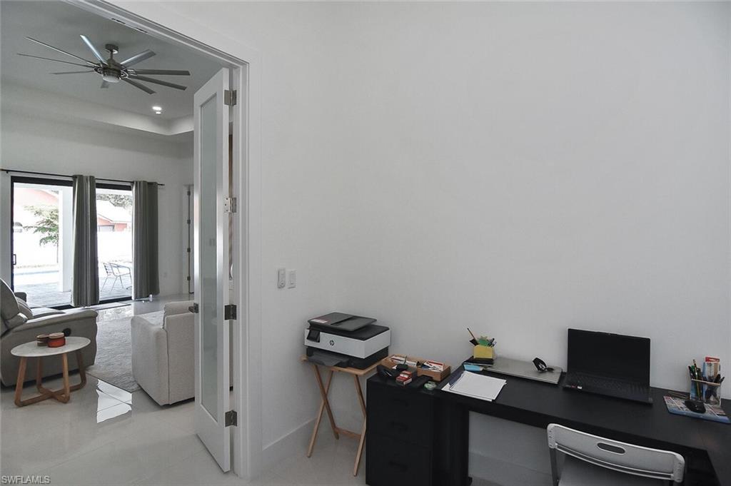 Office area with ceiling fan, light tile patterned floors, and recessed lighting