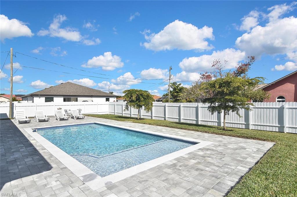 View of pool featuring a fenced backyard and a patio area
