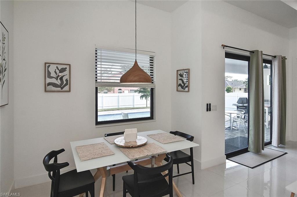 Dining room featuring plenty of natural light and light tile patterned floors