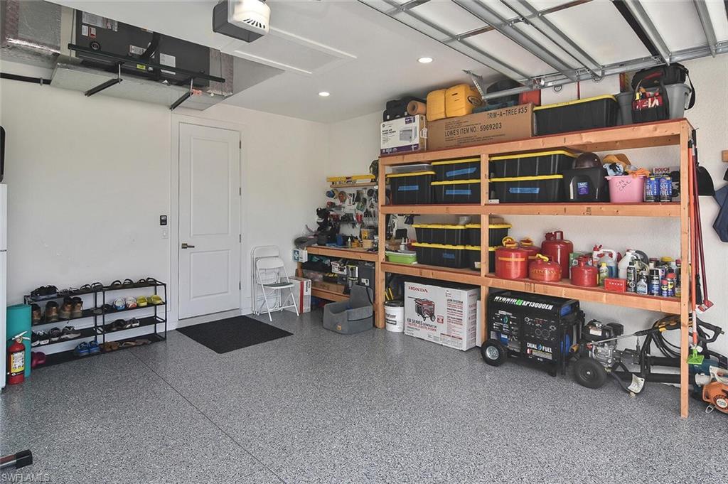 Garage featuring a garage door opener