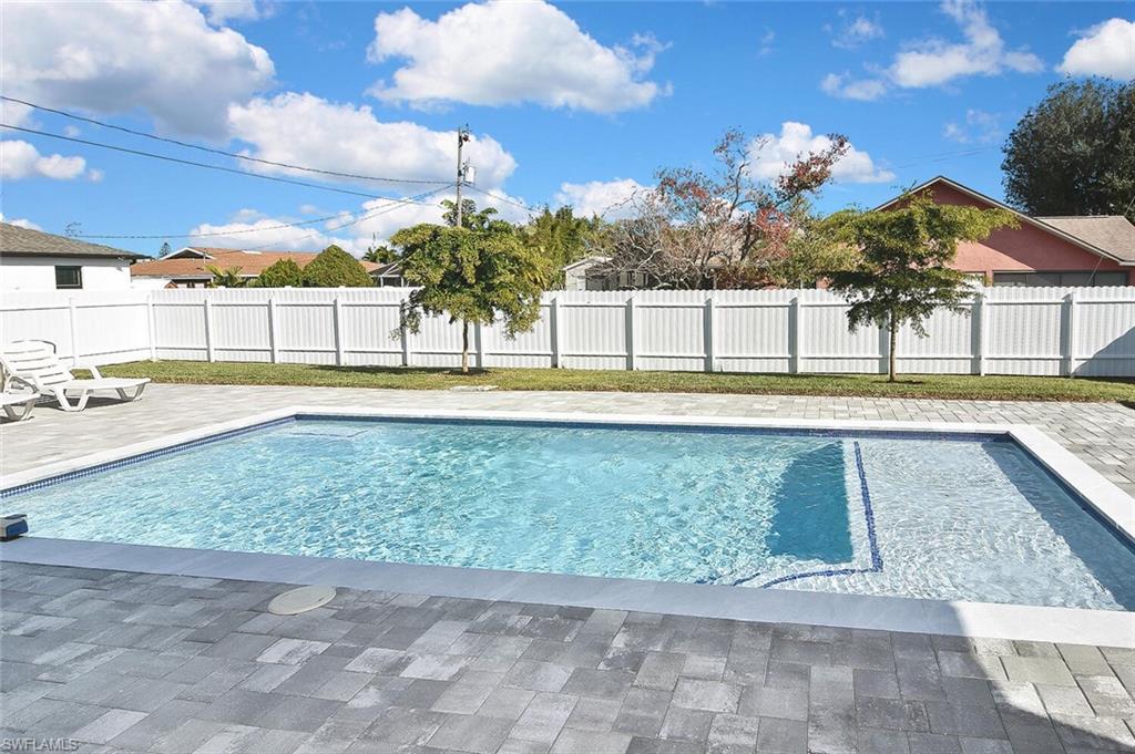 View of pool featuring a patio area and a fenced backyard
