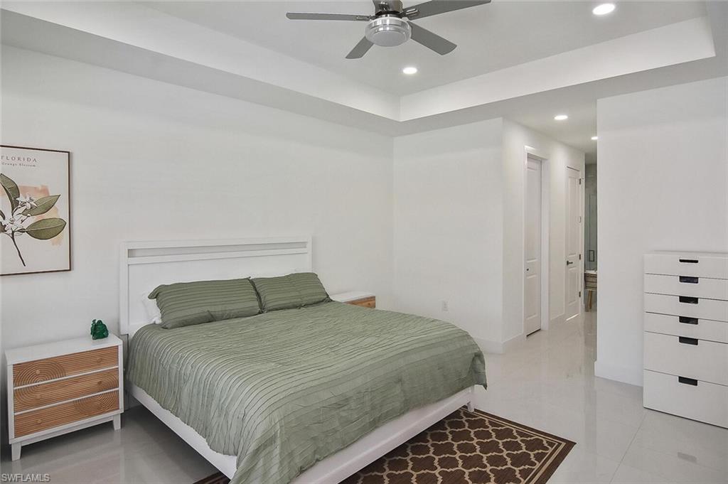 Bedroom featuring recessed lighting, ceiling fan, and light tile patterned floors