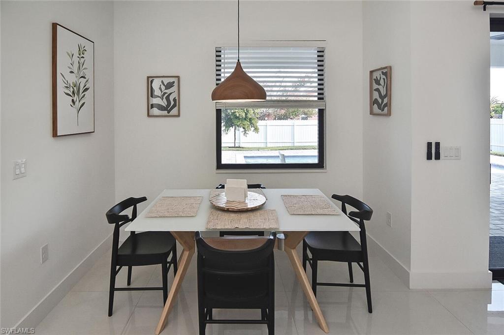 Dining room featuring light tile patterned floors