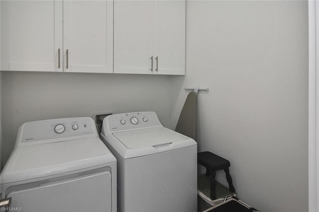 Laundry area with cabinet space and independent washer and dryer