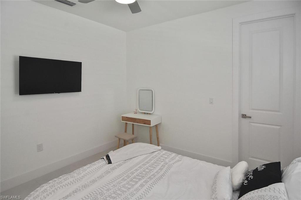Bedroom featuring baseboards and ceiling fan