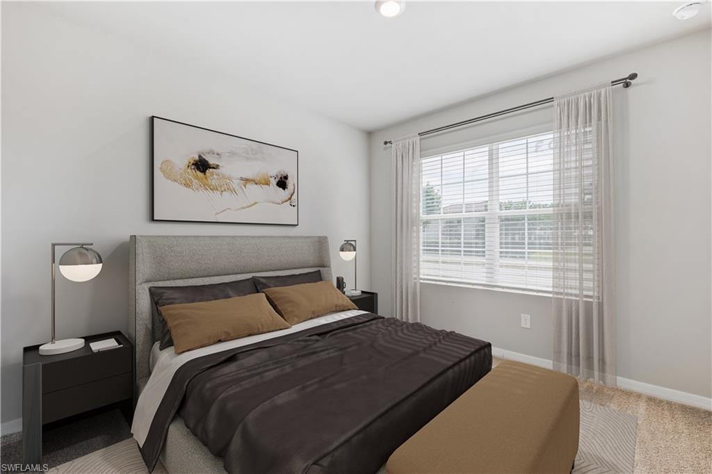 This image is virtually staged. Carpeted bedroom with baseboards