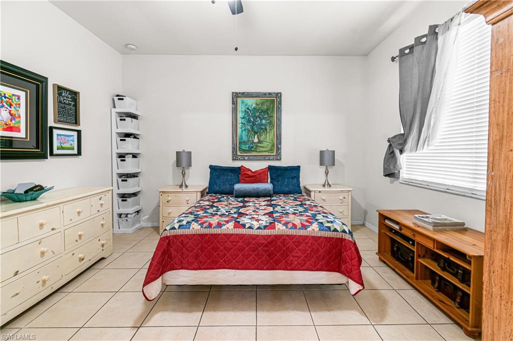 Recessed lighting, ceiling fan, tile flooring, window with blinds, and white wall finishes