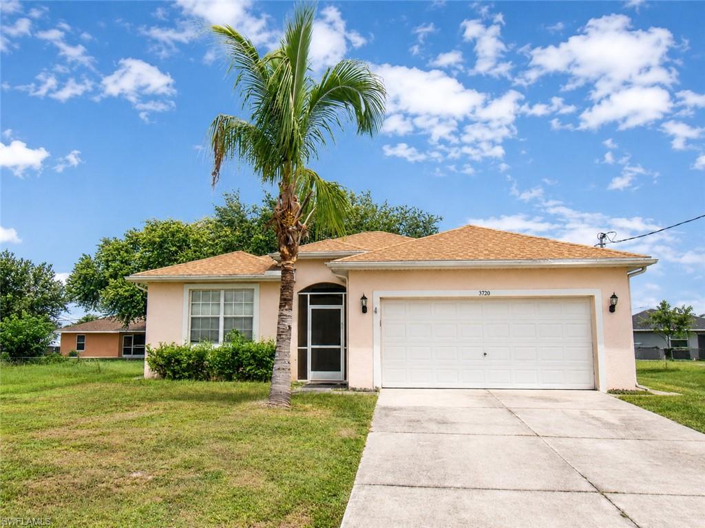 Single-story exterior with a light-toned stucco finish